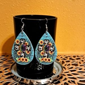 NWT Sunflower cross drop earrings